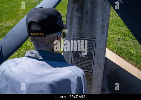 Retired Master Sgt. Eugene T. Beal reads a plaque at a B-29 Superfortress propeller display April 3, 2023, at Beale Air Force Base, California. Eugene spent most of his career as a boom operator in the KC-97 Stratofreighter and the KC-135 Stratotanker. Upon enlisting in March 1952, he was sent to fight in the Korean War as a tail gunner in the B-29 Superfortress. Stock Photo