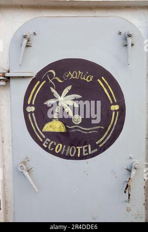 The Rosario EcoHotel logo painted on a door in Isla Grande Colombia Stock Photo