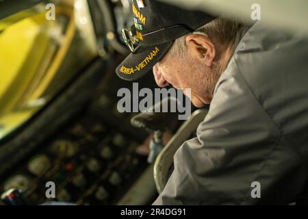 Retired Master Sgt. Eugene T. Beal lays in the boom operator’s controls of a KC-135 Stratotanker, April 3, 2023, at Beale Air Force Base, California. Eugene enlisted in the U.S. Air Force in March 1952 as a tail gunner in the B-29 Superfortress. After he completed basic training and gunner school, he was immediately sent to fight in the Korean War. Stock Photo