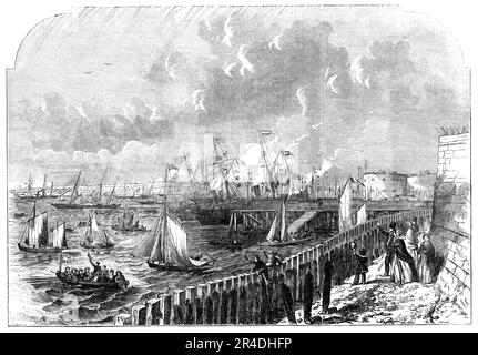 The Naval Review: the Queen's Yacht leaving Portsmouth Harbour, 1856. Queen Victoria attends a display by the Royal Navy off the Hampshire coast. 'Her Majesty was accompanied on board by the Lords of the Admiralty, Sir Edmund Lyons, Admiral De la Graviere, and Mr. Osborne, Secretary to the Admiralty. After a short interval the yacht rapidly steamed out of the harbour, when the forts immediately saluted. The Queen was most enthusiastically cheered by the assembled thousands on the shore as the yacht pursued her course towards the Spit Buoy, on rounding which the whole of the fleet manned their Stock Photo