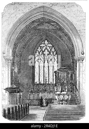 New Church of St. Saviour, Warwick-Road, Paddington [in west London] - the Chancel, 1856. Interior view of church in '...the adapted Gothic style...the architect has dispensed with side-aisles, clerestory, columns, &amp;c , and formed a hall or auditorium, with handsome open timber roof and windows, the tracery of which is Second Pointed or Decorated, slightly inclining to flamboyant...The chancel is, more correctly, according to the ancient model...The reredos, by Mr. Farmer, is of Caen stone, richly carved, having columns of serpentine marble...The pulpit is a handsome piece of work, richly Stock Photo
