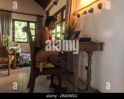 Working in a luxury resort, Lake Peten Itza, El Remate, Petén, Guatemala Stock Photo