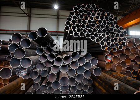 Steel pipes and tubes on warehouse Stock Photo