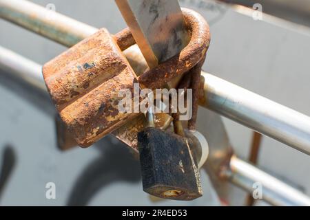Rusty old padlock on an old gate Stock Photo