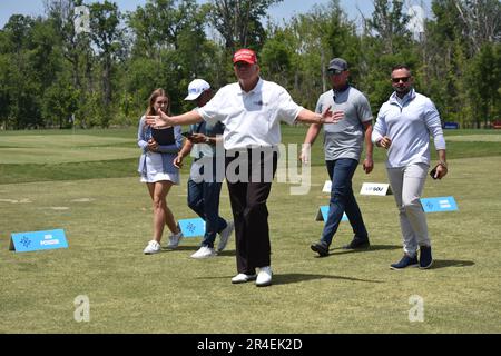 Sterling, United States. 27th May, 2023. Former President of the United States Donald J. Trump walks by fans and talks with them. Former President of the United States Donald J. Trump visits the driving range, meets fans and watches LIV Golf Washington DC 2023 Round 2 at Trump National Golf Club Washington DC in Sterling, Virginia, United States. (Photo by Kyle Mazza/SOPA Images/Sipa USA) Credit: Sipa USA/Alamy Live News Stock Photo