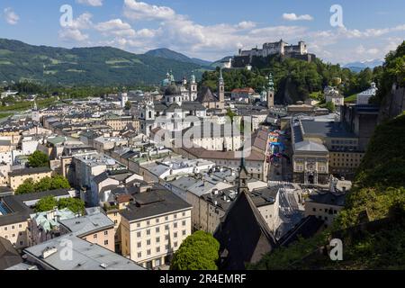 The Hohensalzburg Fortress rises above the Old Town of Salzburg, Austria, seen here from the Mönchsberg. Stock Photo