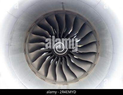 Airplane Turbo Jet Engine Large Propeller Spiral Blades Close Up.  Centered Concentric Metalic Turbine Circles on White Background Stock Photo