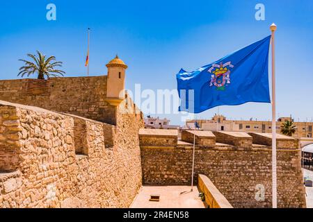 Flag of the city of Melilla waving in the Plaza de Armas. Second Fortified Enclosure of Melilla la Vieja of Melilla. Melilla, Ciudad Autónoma de Melil Stock Photo