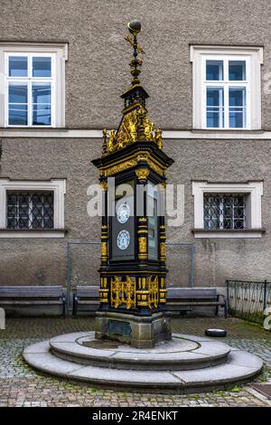 The listed historical weather station at the Alter Markt in Salzburg, Austria, has measured temperature and air pressure since 1888. The black-and-gold, turret-shaped structure still displays its historical thermometer and barometer dials today. Stock Photo