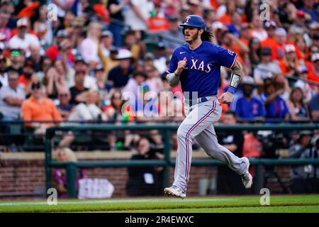 Texas Rangers' Jonah Heim looks to the sky as he scores on his