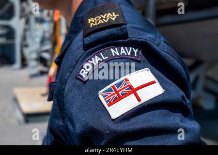 New York, New York, USA. 26th May, 2023. Royal Navy ensign on uniform of a seaman of the Ocean Survey Vessel HMS Scott is part of the flotilla of ships visiting NYC for Fleet Week NYC. The Scott is responsible for the collection and processing of navigational data of the ocean floor as it supports the defense interests of the Royal Navy of the UK. (Credit Image: © Milo Hess/ZUMA Press Wire) EDITORIAL USAGE ONLY! Not for Commercial USAGE! Stock Photo