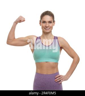 Portrait of sportswoman showing muscles on white background Stock Photo