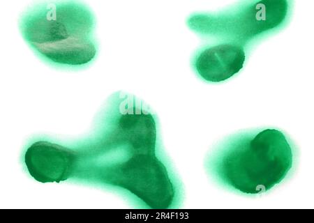 Green spray paint spots on white background Stock Photo