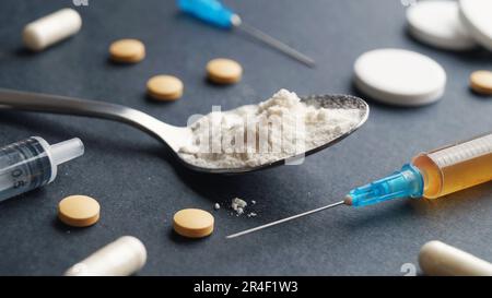 Different hard drugs on black background, closeup Stock Photo