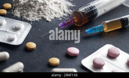 Different hard drugs on black background, closeup Stock Photo