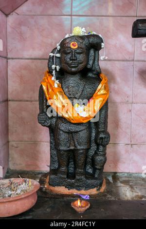 A stone image depicting Sri Kaththavarayar Swami within Sri Muthumariamman Thevasthanam Hindu Temple at Matale in Sri Lanka. Stock Photo