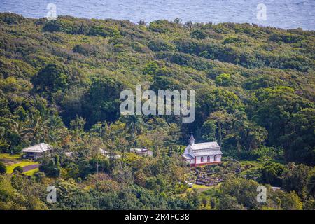 St. Gabriel's Church is also known as the Coral Miracle Church And Our Lady Of Fatima Shrine, Wailua, Maui, Hawaii. The church is white because the wa Stock Photo