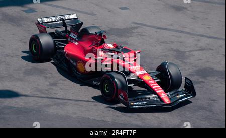 Ferrari driver Charles Leclerc of Monaco walks with a teammate through the F1 paddock at the