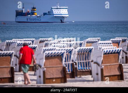 Rostock, Germany. 28th May, 2023. The Finnish ferry 'Seagard' enters the seaport coming from Kotka (Finland) while most of the beach chairs on the Baltic Sea coast are still empty in the morning. With lots of sunshine and high temperatures, the weather shows its best side in northern Germany on Whit Sunday. Credit: Jens Büttner/dpa/Alamy Live News Stock Photo