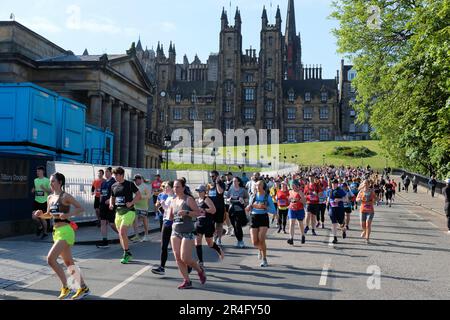 Edinburgh, Scotland, UK. 28th May 2023. The Edinburgh Half Marathon with over 12,000 participants starting in the shadow of the McEwan Hall at Bristo Square. The marathon course was voted the fastest marathon in the UK by Runners World, ideal for those looking for a personal best time. The course winds around the city centre then heads east along the coast to Prestonpans and finishes outside Musselburgh. Running down the Mound. Credit: Craig Brown/Alamy Live News Stock Photo