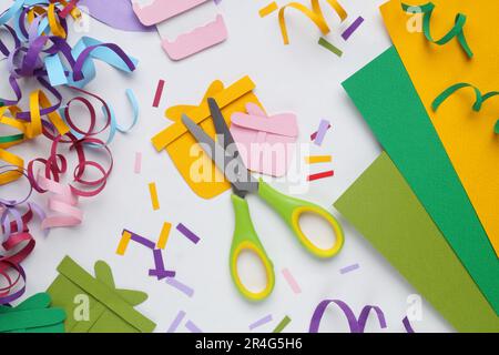 Flat lay composition with stationery, confetti and paper gift boxes on white background Stock Photo
