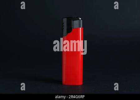 Stylish small pocket lighter on black background Stock Photo