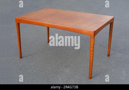 A mid century teak dining table 50s 60s Danish Design Vintage Dining solid wood Modern antique retro original isolated on white wall in modern Stock Photo