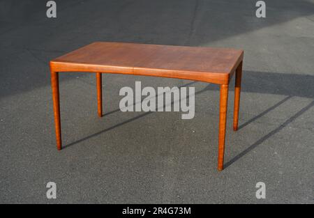 A mid century teak dining table 50s 60s Danish Design Vintage Dining solid wood Modern antique retro original isolated on white wall in modern Stock Photo