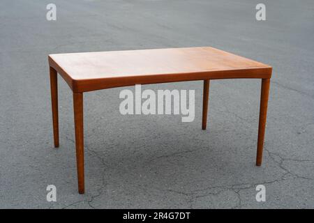 A mid century teak dining table 50s 60s Danish Design Vintage Dining solid wood Modern antique retro original isolated on white wall in modern Stock Photo