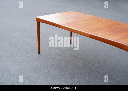 A mid century teak dining table 50s 60s Danish Design Vintage Dining solid wood Modern antique retro original isolated on white wall in modern Stock Photo