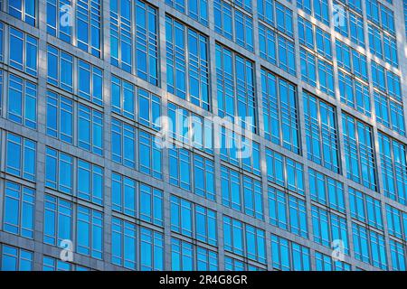 Facade of an office building with lots of glass Stock Photo