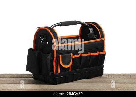 Empty bag for tools on wooden table against white background Stock Photo