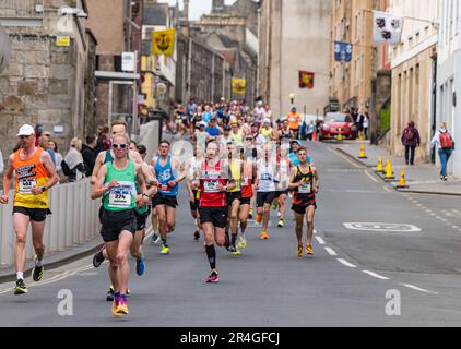 Edinburgh, Scotland, UK, 28th May 2023. Edinburgh Marathon: some of the thousands of marathon runners run down the Royal Mile in the early stage of the route. Credit: Sally Anderson/Alamy Live News Stock Photo