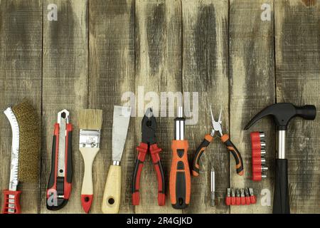 Layout of construction tools. Top view of construction tools on a wooden background. Copy space Stock Photo