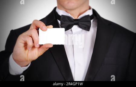 Businessman handing a blank business card Stock Photo