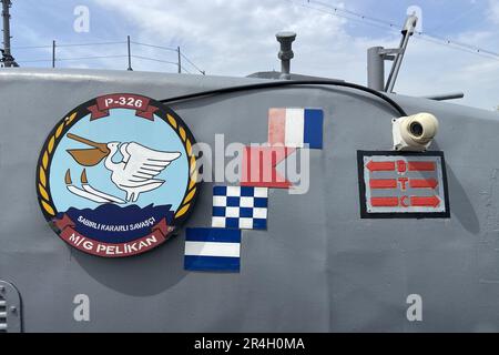 Outside details of retired vintage military naval sea vessel navy warship number, heavy machine gun, nautical flag, antenna, bridge of destroyer Stock Photo