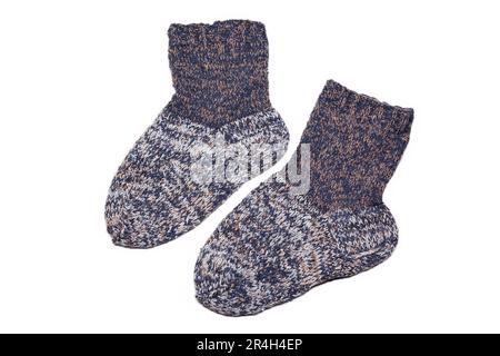 Knitted wool, handmade socks on a white background Stock Photo