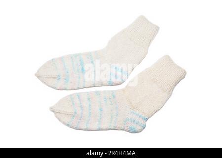 Knitted wool, handmade socks on a white background Stock Photo