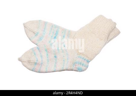 Knitted wool, handmade socks on a white background Stock Photo