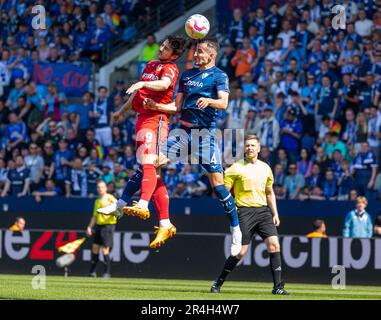 sports, football, Bundesliga, 2022/2023, VfL Bochum vs. Bayer 04 Leverkusen 3-0, Vonovia Ruhr Stadium, scene of the match, aerial duel between Sardar Azmoun (Lev) left and Erhan Masovic (VfL), right referee Tobias Welz, DFL REGULATIONS PROHIBIT ANY USE OF PHOTOGRAPHS AS IMAGE SEQUENCES AND/OR QUASI-VIDEO Stock Photo