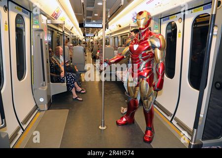 London, UK. 28th May, 2023. Iron Man riding the Elizabeth Line to MCM London Comic Con 2023. Iron Man decided not to fly in to the show which takes place at Excel, choosing rather to let the train take the strain. Maybe he just wanted to try out the new line which has only recently been fully opened. Credit: Paul Brown/Alamy Live News Stock Photo