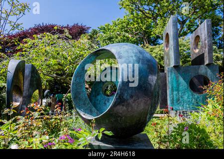 Bronze Form (Patmos) 1962-3, cast 1963 with Two forms (divided circle) 1969, and Four-Square (Walk Through) 1966. Bronze - The Barbara Hepworth Museum and Sculpture Garden opereated by the Tate St Ives. Sunny weather for the bank holiday weekend in St Ives. Stock Photo