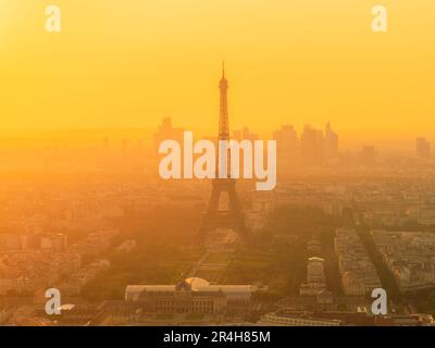 Golden hour light casting on the evening haze in Paris on a fine evening from the Montparnasse Tower observation deck. Stock Photo