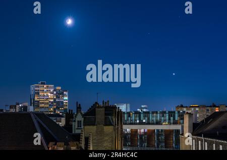 Quarter moon and Venus shining in clear night sky, Leith, Edinburgh, Scotland, UK Stock Photo