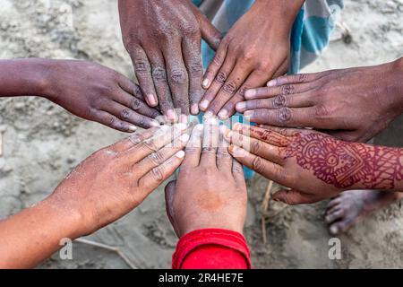 Team put hands together. Business people jointly symbolize hands together To show team work Stock Photo