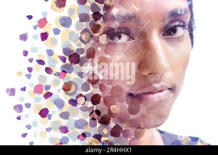 A paintography portrait of a young woman's face combined with paint dots Stock Photo