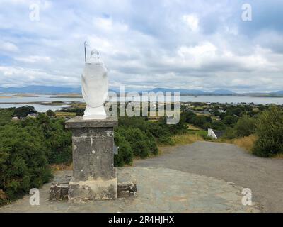 White statue of Saint Patrick at the start of foot path to the peak of Croagh Patrick, county Mayo, Ireland Stock Photo