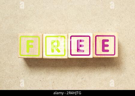 Wooden alphabet letter block in word free on wood background Stock Photo