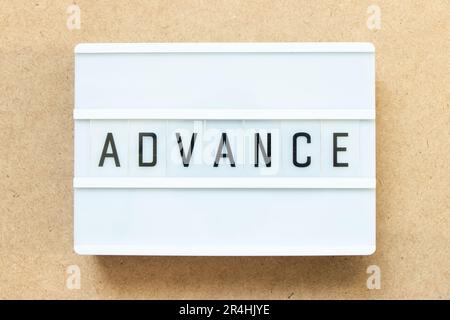 Lightbox with word advance on wood background Stock Photo
