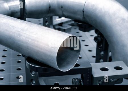 Detail of stainless steel pipe, industry metal processing concept blue tone background Stock Photo